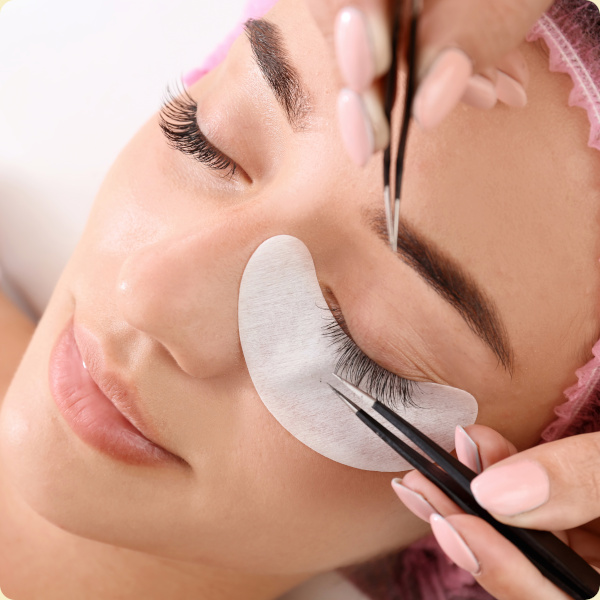 Eyelash extension application on a woman