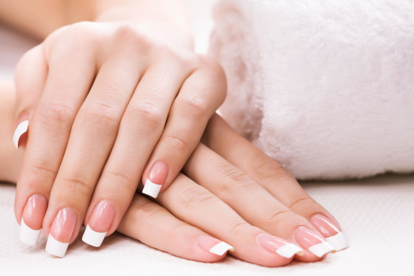 Woman hands with french manicure