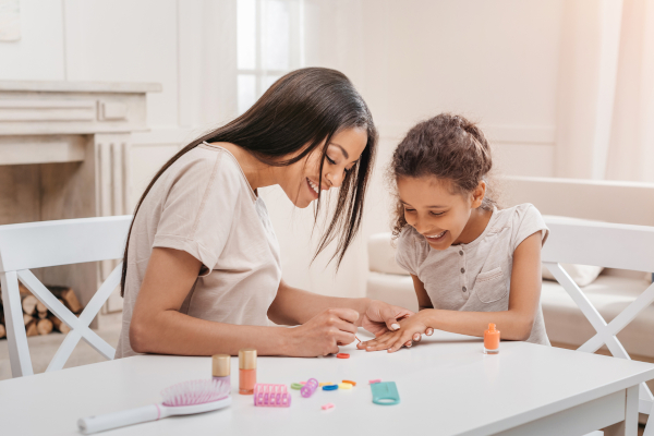 Child getting nail spa service